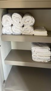 a bunch of towels are sitting on a shelf at Ventanas Del Mar - 04B-4G Oceanview in El Quindio