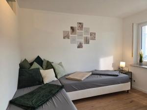 a bedroom with a bed and a window at Gemütliches Apartment mit Balkon - Hans NU2 in Neu Ulm