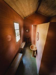 a small bathroom with a sink and a toilet at Camping Tiradentes in Tiradentes +109 photos