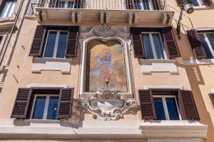 a painting of a woman on the side of a building at AGH Pantheon in Rome