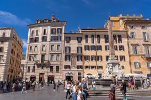 a group of people walking around a city with buildings at AGH Pantheon in Rome