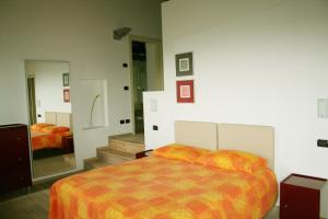 Postel nebo postele na pokoji v ubytování Agriturismo Nicobresaola