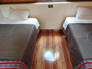 Postel nebo postele na pokoji v ubytování Lucmabamba Cottage + 1 fotografie