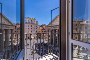 a view of a city from a window at AGH Pantheon in Rome +52 photos
