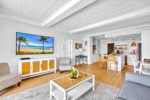a living room with a couch and a table at The Whaler by KBM Resorts in Kaanapali
