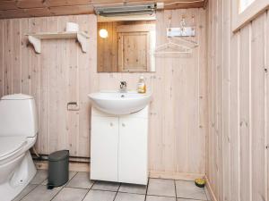 a bathroom with a sink and a toilet at Luxury Spa Retreat in Blavand - By Traum Ferienwohnungen in Blåvand +35 photos