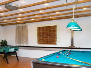 a pool table in a living room with a ceiling at 6 person holiday home in Gilleleje in Gilleleje