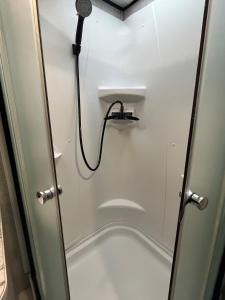 a shower in a bathroom with a shower at Glamping at Double S Farms in Spring Hill +21 photos