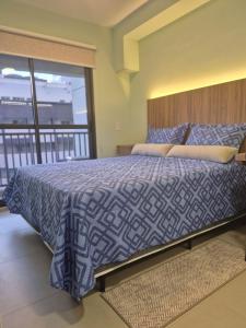 En eller flere senge i et værelse på Studio 5 Estrelas República