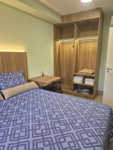 En eller flere senge i et værelse på Studio 5 Estrelas República