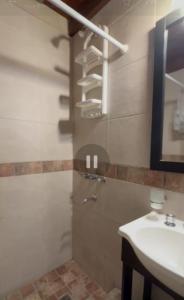 a bathroom with a sink and a shower and a sink at Family Home en Costa Azul in Costa Azul