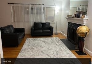 a living room with a couch and a fireplace at Spacious 5BR Arlington Home with Parking & Yard - Woodrow in Arlington