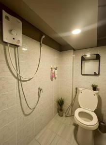 a bathroom with a toilet and a shower at Youyen ll Hostel in Don Muang Airport