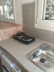 a kitchen counter with a sink next to a sink at Wangülén in San Carlos de Bariloche