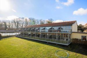 a large building with a lot of windows at 5579-Gudhjem-Sdr-Strandvej-128-1-lejl-17 in Gudhjem