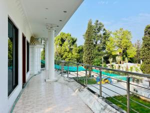 a balcony with a view of a swimming pool at Shalman guest house in Islamabad