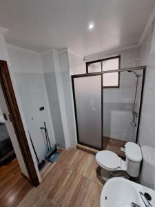 a bathroom with two toilets and a shower at Departamento privado a pasos del centro in Constitución