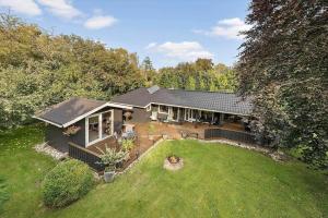an aerial view of a house with a yard at LF11351-Farso-Fjordparken-19 in Lovns