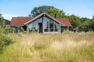 a house in a field with tall grass at SB56207-Sydals-Solbjergvej-26 in Sønderby