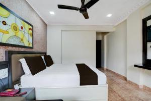 Postel nebo postele na pokoji v ubytování Townhouse Hotel Bhopal Station Inn