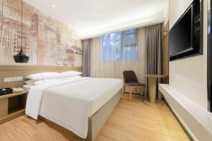 Μια τηλεόραση ή/και κέντρο ψυχαγωγίας στο City Comfort Inn Wuhan Xudong Street Wangjiadun Metro Station