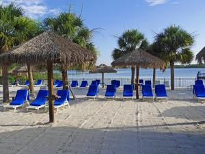 a group of chairs and umbrellas on a beach at Bahama Bay, Grand Bahama spacious 3-bedroom Penthouse near Disney in Kissimmee