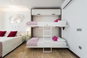 Postel nebo postele na pokoji v ubytování Suites Garden Loft Munch