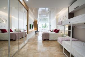 Postel nebo postele na pokoji v ubytování Suites Garden Loft Munch