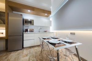 Kuchyň nebo kuchyňský kout v ubytování Suites Garden Loft Munch