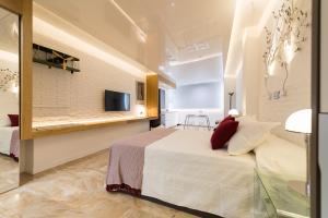 Tempat tidur dalam kamar di Suites Garden Loft Munch