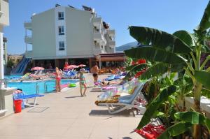 a group of people at the pool at a resort at Candan Apart in Marmaris