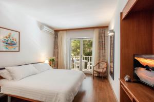 Postel nebo postele na pokoji v ubytování Orsan Maradiso Hotel by Aminess