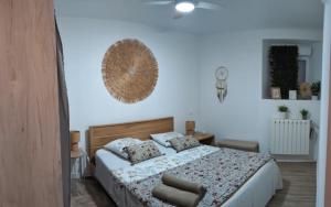 a bedroom with a large bed with a large mirror at Appartement Cocooning Béziers Cœur historique, charme et confort noté 10 in Béziers