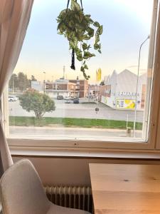 a window with a view of a parking lot at Midnight Sun center apartments in Sodankylä
