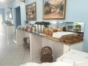 a room with a counter with food on it at Pousada Ilha do Sol in Salinópolis