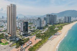 an aerial view of a beach with buildings and the ocean at Wyndham Soleil Danang - Free Two ways Airport Transport in Da Nang