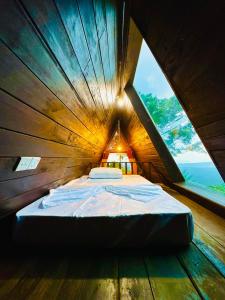 Postel nebo postele na pokoji v ubytování Araliya Garden Nest