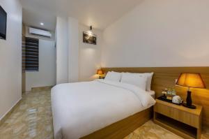 Postel nebo postele na pokoji v ubytování Cat Ba Hong Kong Cozy Stay