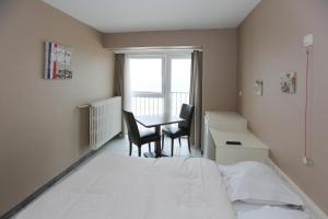 Postel nebo postele na pokoji v ubytování Hotel De Zeebries