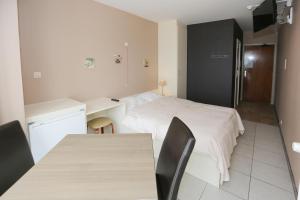 Postel nebo postele na pokoji v ubytování Hotel De Zeebries