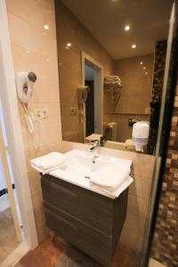 Een badkamer bij Hotel De Zeebries