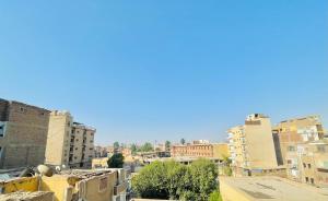 a view of a city with tall buildings at شقه للايجار اليومي او الشهري in Luxor +7 photos