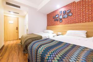 Postel nebo postele na pokoji v ubytování 落脚城市青年旅舍