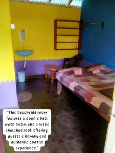 a room with a bed and a sink in it at Prakruti Gokarna in Jāmb