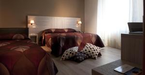 Ένα ή περισσότερα κρεβάτια σε δωμάτιο στο Albergo Valentina