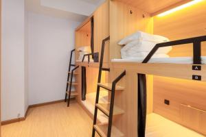 Postel nebo postele na pokoji v ubytování 落脚城市青年旅舍