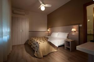 Postel nebo postele na pokoji v ubytování Albergo Valentina