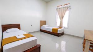 Кровать или кровати в номере Grand Soe Hotel