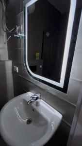 a bathroom with a sink and a mirror at Luxury furnished apartment in Irbid