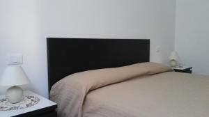Postel nebo postele na pokoji v ubytování Le Casette